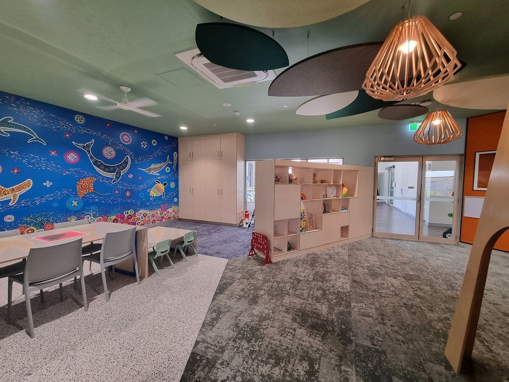 A Room With Tables and Chairs and a Mural on the Wall — Nick Favot Painting in Bohle, QLD