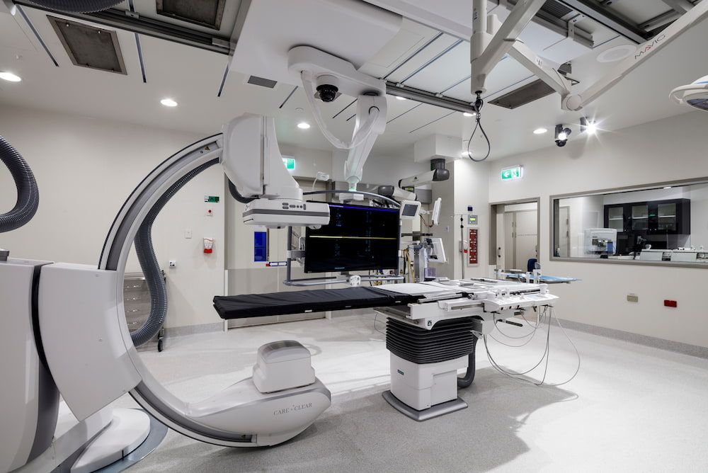 An Operating Room in a Hospital With a Large Surgical Machine — Nick Favot Painting in Bohle, QLD