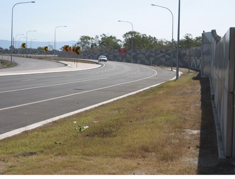A Car is Driving Down a Road Next to a Fence — Nick Favot Painting in Bohle, QLD