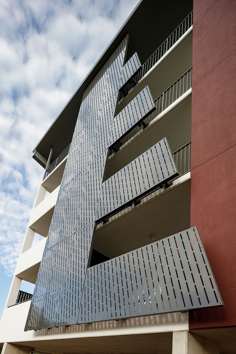Apartment Building With Perforated Metal Panels Covering Balconies — Nick Favot Painting In Bohle, QLD