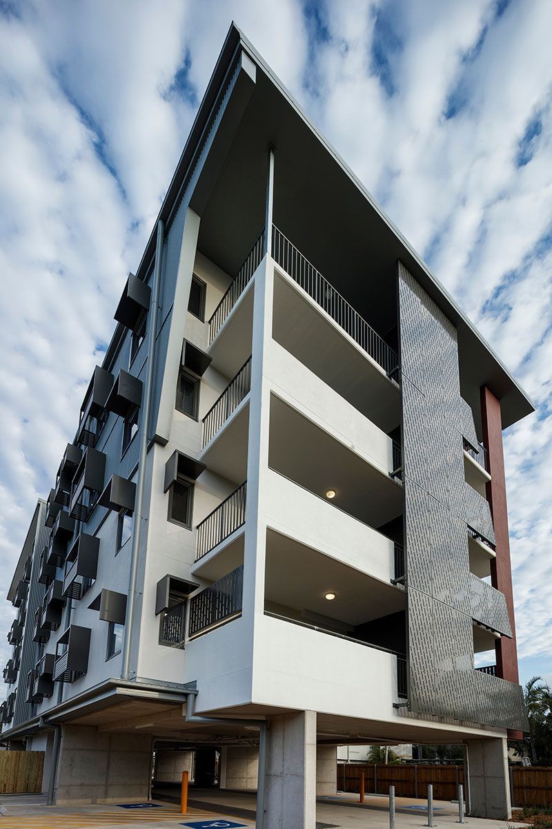 Modern Building Facade With Perforated Metal Panels — Nick Favot Painting In Bohle, QLD