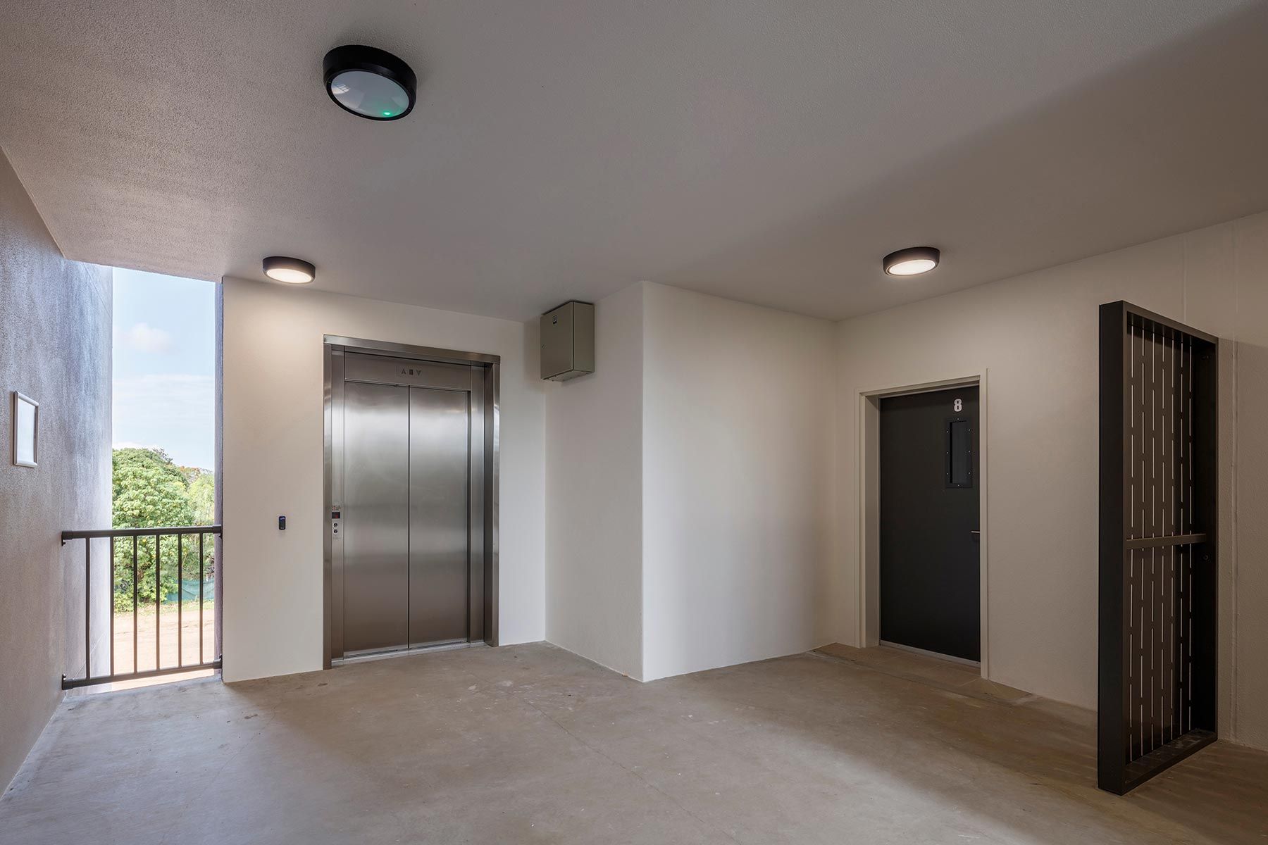 Apartment Building Hallway With a Silver Elevator — Nick Favot Painting In Bohle, QLD