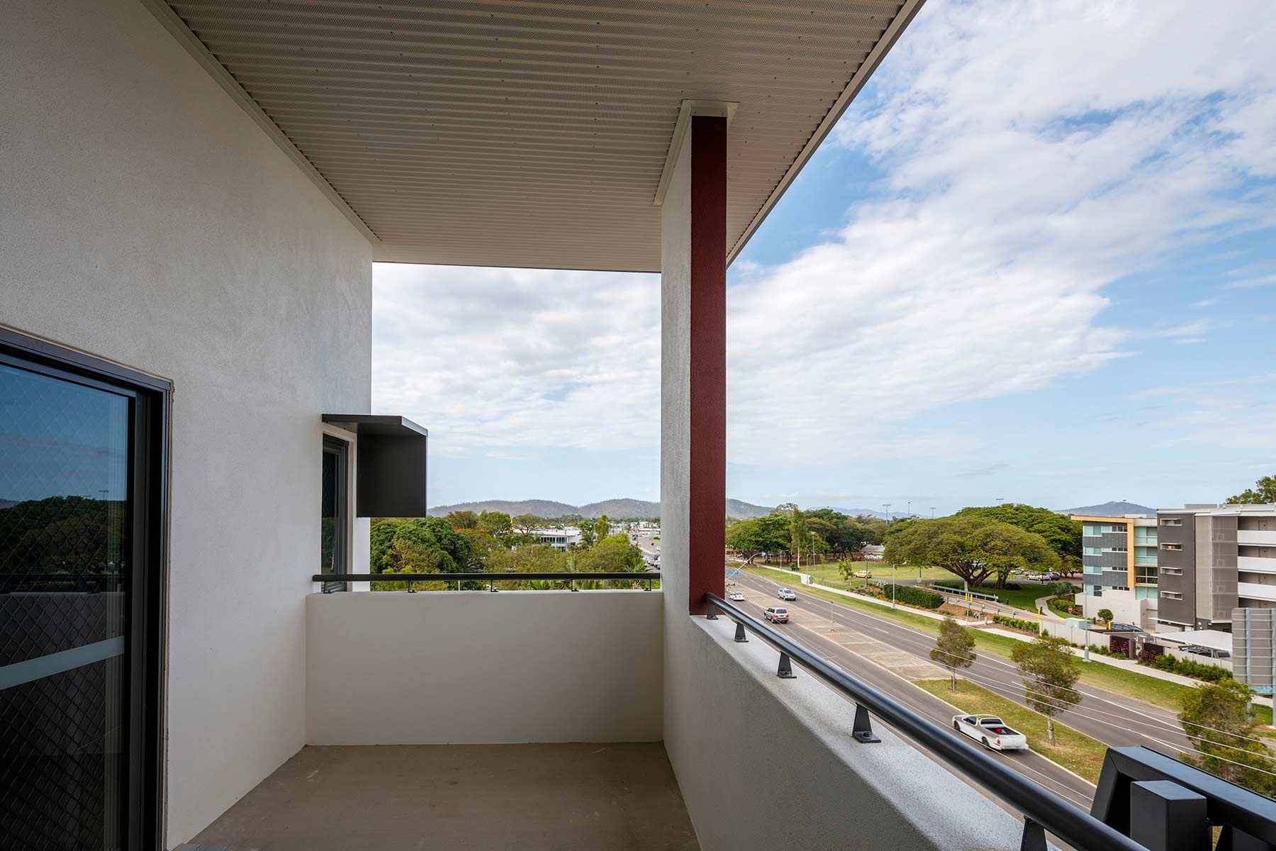 Modern Apartment Balcony With Glass Doors and Railings — Nick Favot Painting In Bohle, QLD