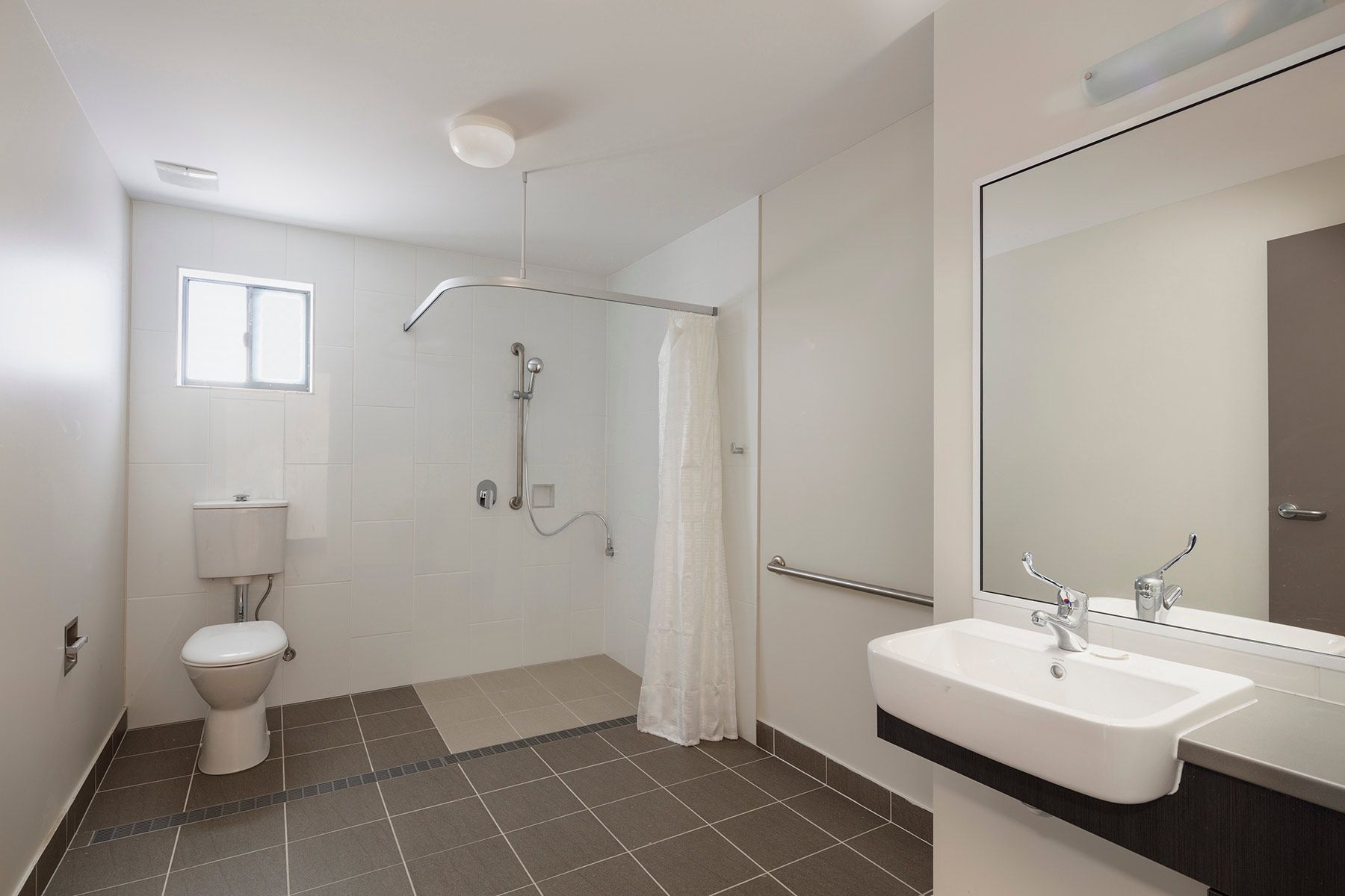 A Bathroom With a Sink, Toilet, and Shower — Nick Favot Painting In Bohle, QLD