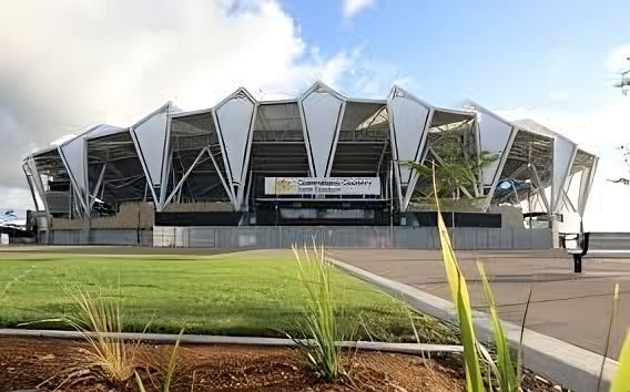 A Large Stadium With a Lot of Grass in Front of It — Nick Favot Painting In Bohle, QLD