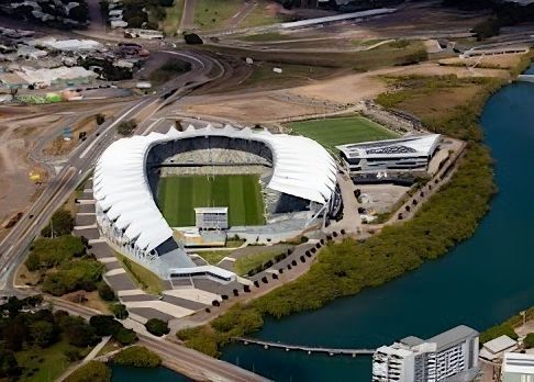 An Aerial View of a Large Stadium Surrounded by Water — Nick Favot Painting In Bohle, QLD