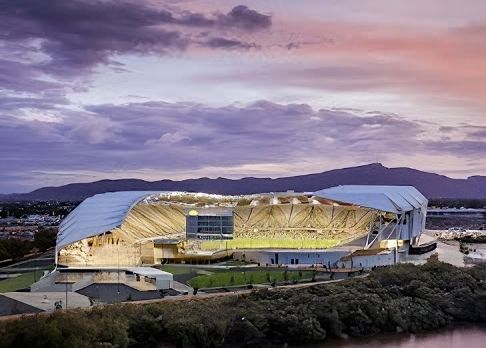 An Aerial View of a Stadium With Mountains in the Background — Nick Favot Painting In Bohle, QLD
