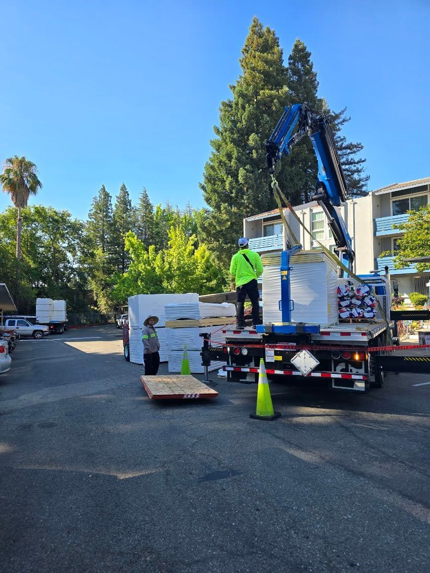 A truck with a crane on the back of it