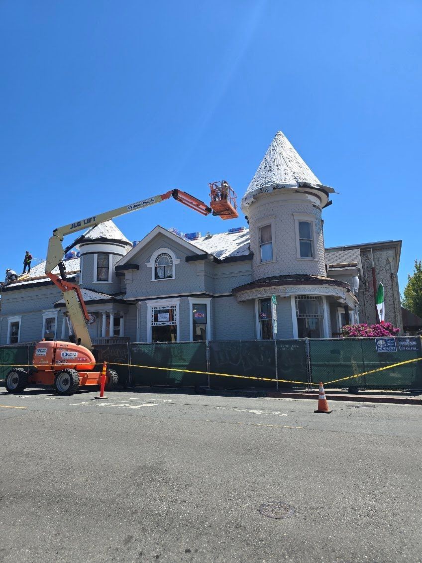 A large house with a crane on top of it