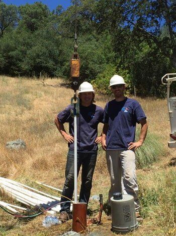 Two People in Blue Working Outdoor — Water Services in North San Juan, CA