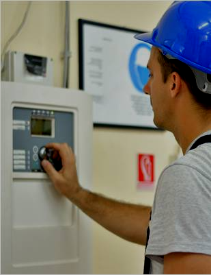 Man inspecting system panel