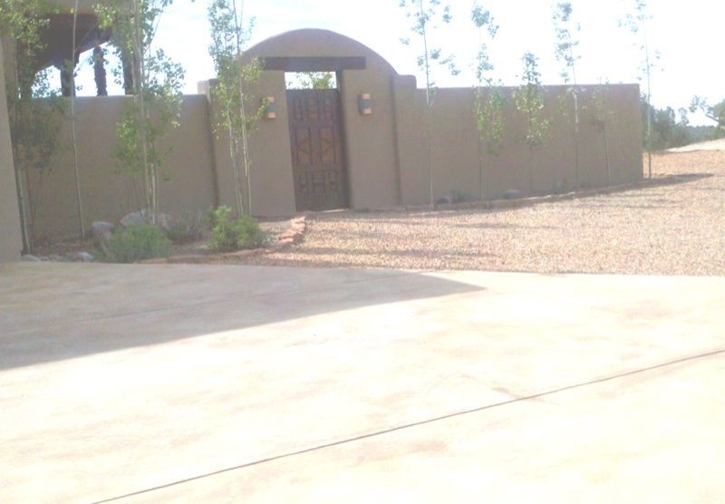 Garden wall with arched entry gate