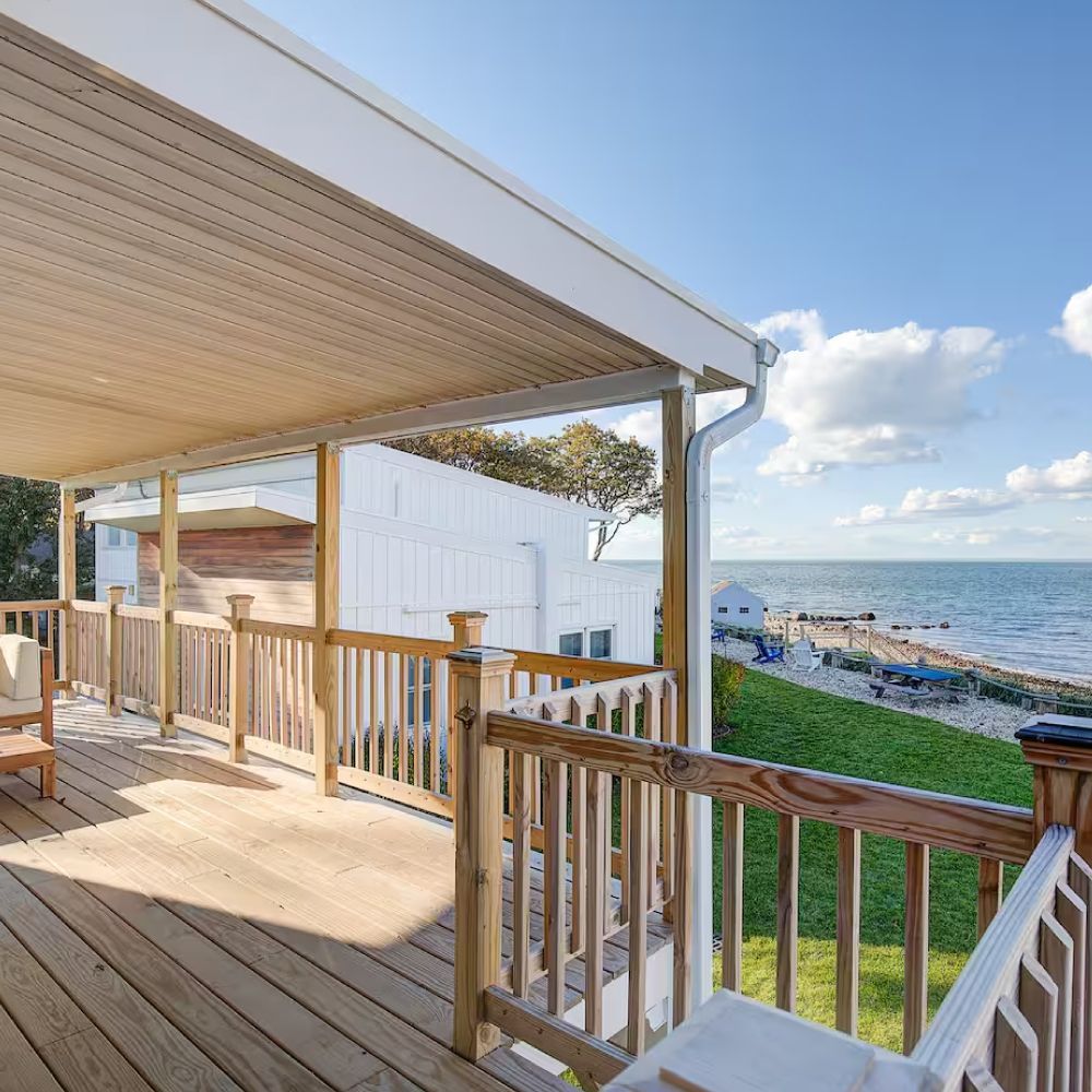 A wooden deck with a view of the ocean