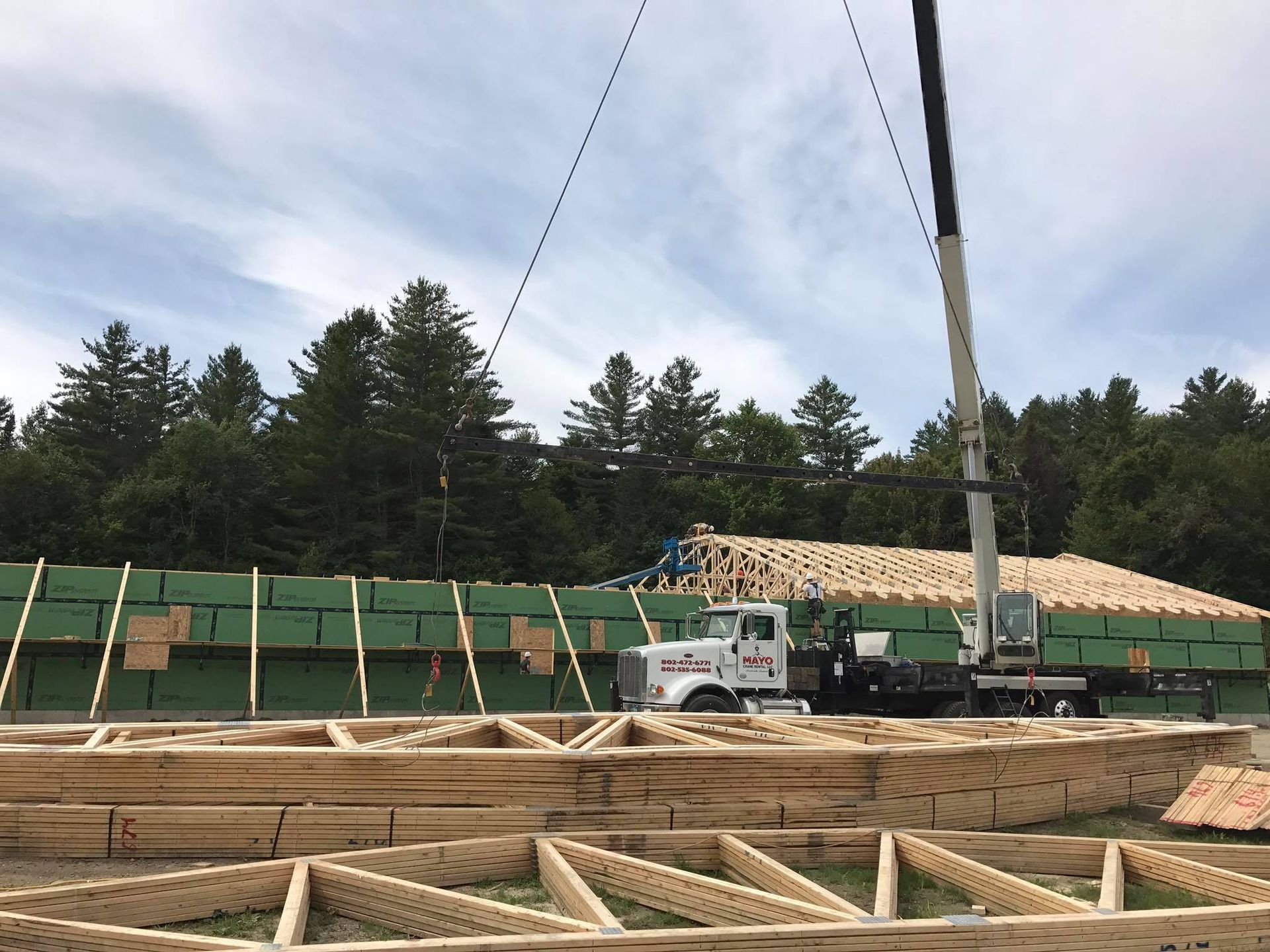 A large crane assists with the construction of a commercial building in Vermont's Northeast Kingdom