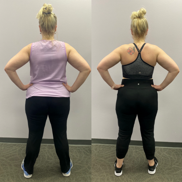 A woman in a purple tank top and black pants stands with her hands on her hips