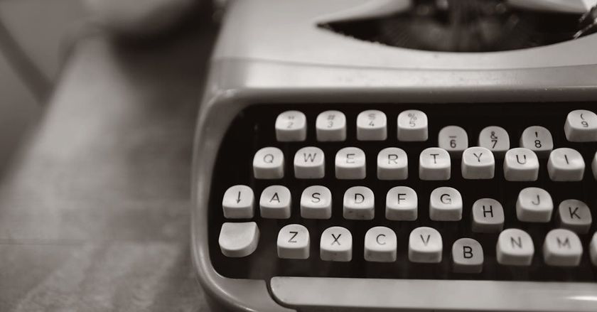 A black and white photo of an old typewriter