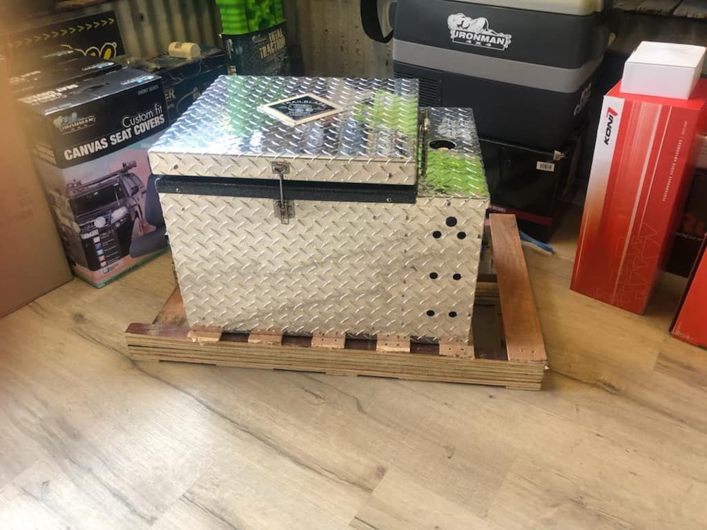 A Metal Box is Sitting on Top of a Wooden Pallet — Westlakes 4x4 Centre in Cessnock, NSW