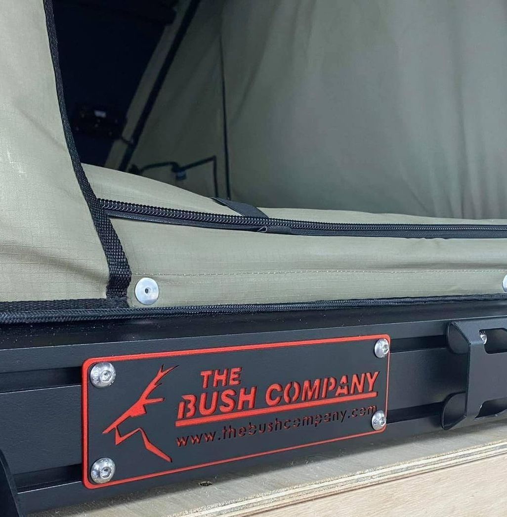 A Black and Red Sign That Says the Bush Company on It — Westlakes 4x4 Centre in Singleton, NSW