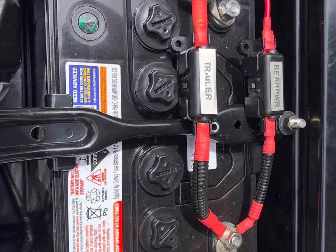 A Close Up of a Car Battery With a Label That Says Tracer — Westlakes 4x4 Centre in Maitland, NSW