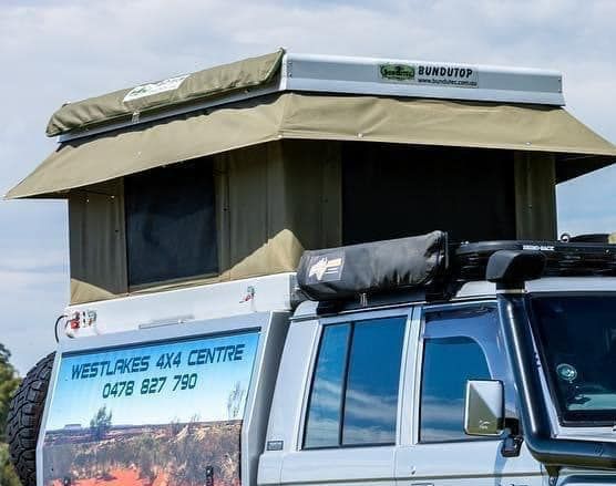 A Truck With a Tent on Top of It That Says Westlands 4x4 Centre — Westlakes 4x4 Centre in Singleton, NSW