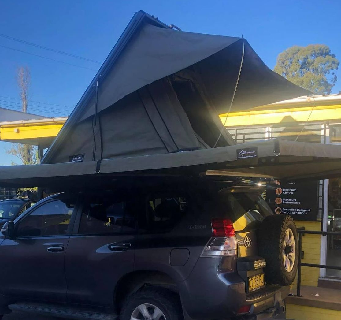 A Gray Suv With a Tent on Top of It — Westlakes 4x4 Centre in Newcastle, NSW