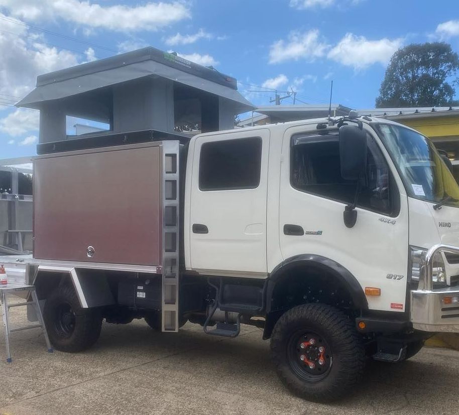 A White Truck With a Wooden Box on the Back is Parked in a Parking Lot — Westlakes 4x4 Centre in Port Stephens, NSW