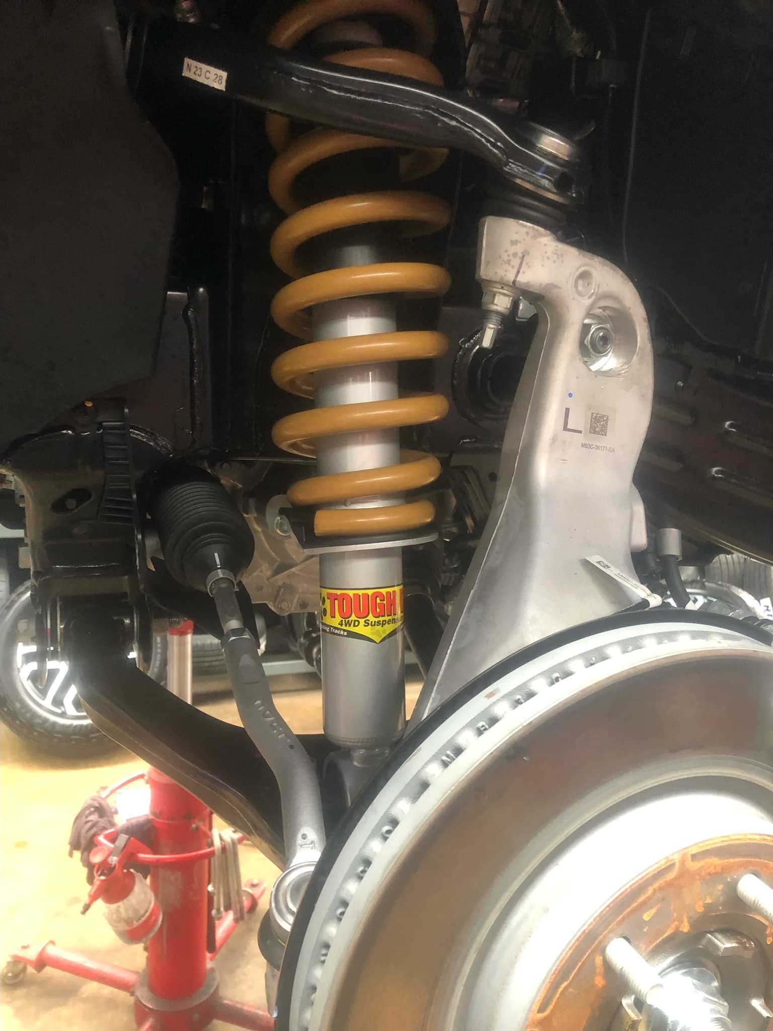 A Close Up of a Shock Absorber on a Car — Westlakes 4x4 Centre in Cessnock, NSW