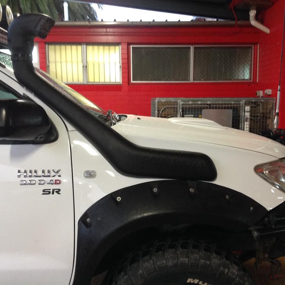 A White Hilux With a Snorkel on the Hood — Westlakes 4x4 Centre in Singleton, NSW