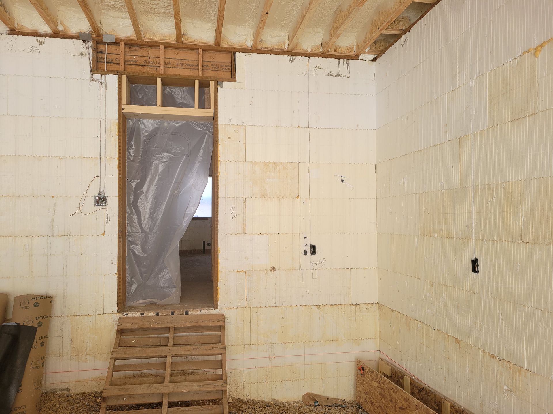 A room with a door and stairs in it