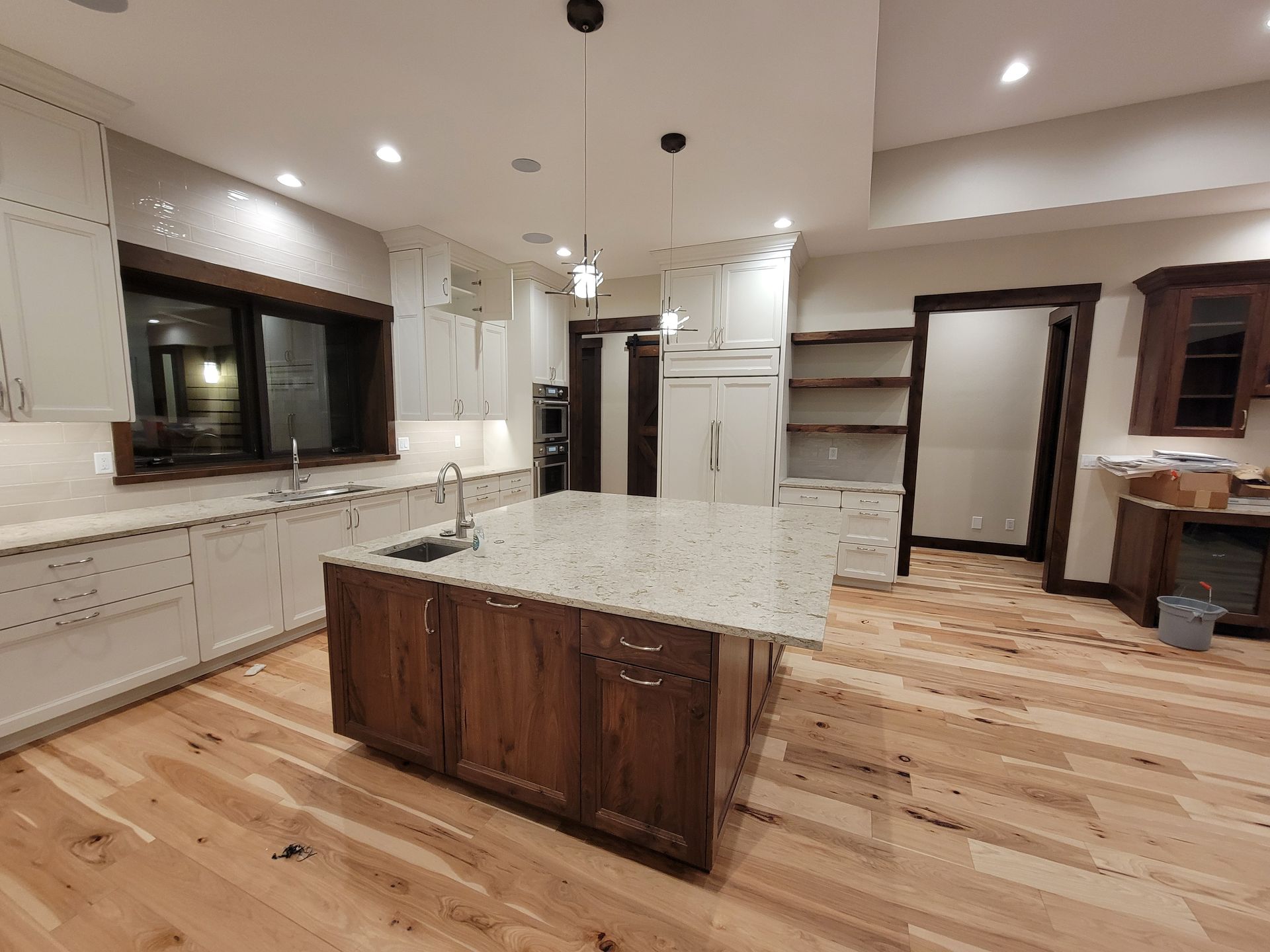 There is a large island in the middle of the kitchen.