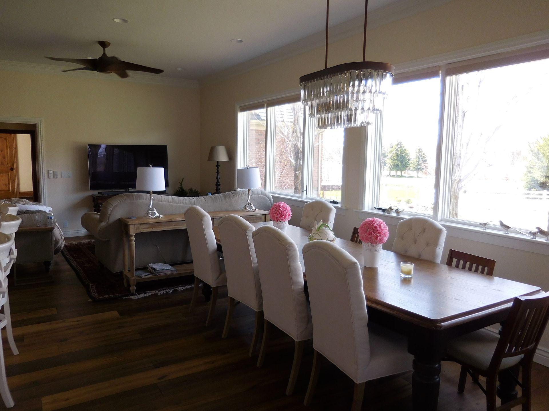 A living room with a dining table and chairs