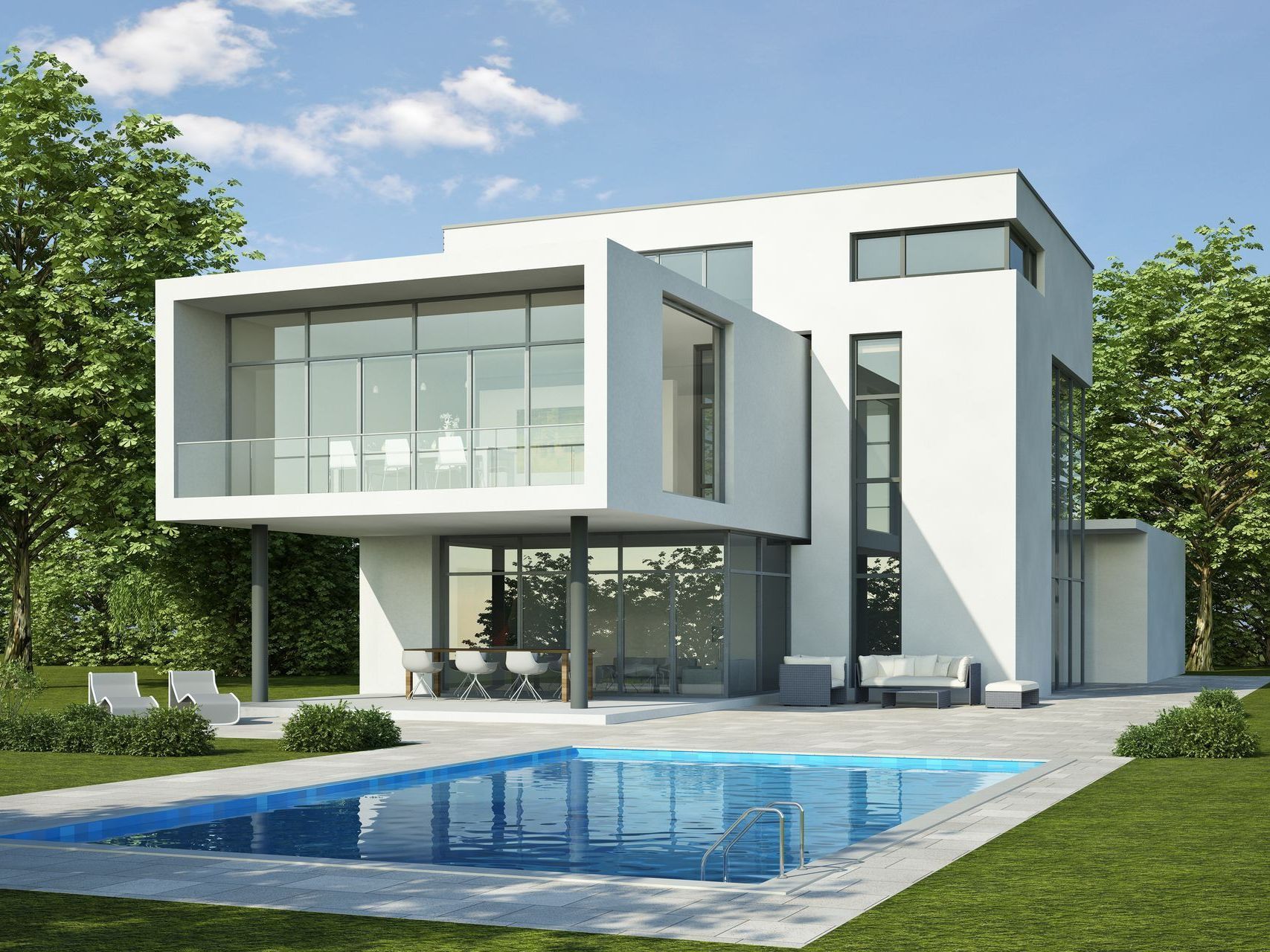 ein modernes Haus mit einem großen Swimmingpool davor.