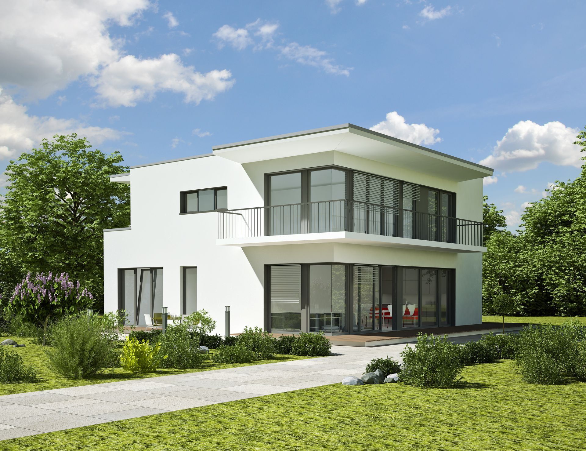 ein weißes Haus mit vielen Fenstern und einem Balkon