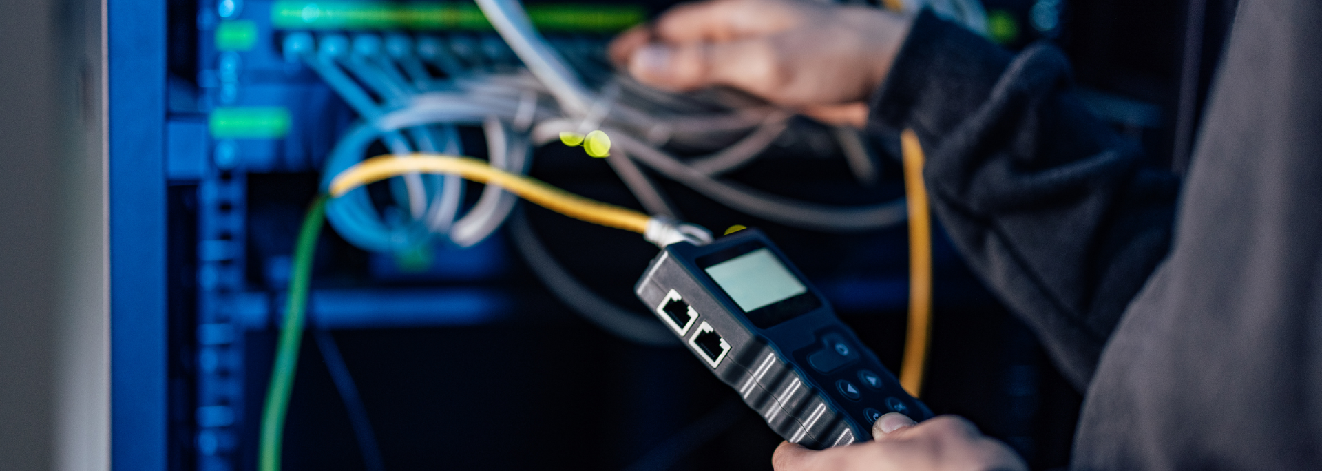 Picture of someone working at a data centre.