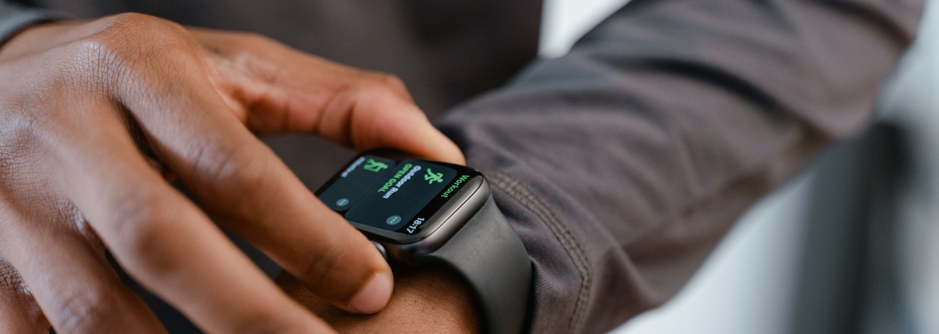 A man is wearing an apple watch on his wrist.