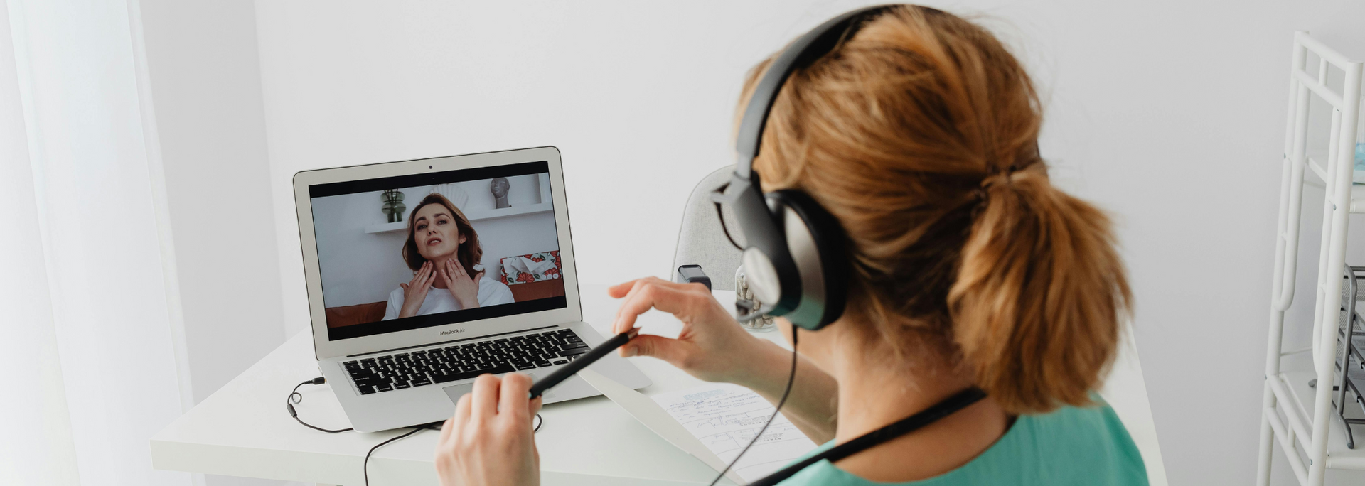 Picture of a GP consultation taking place via video call.