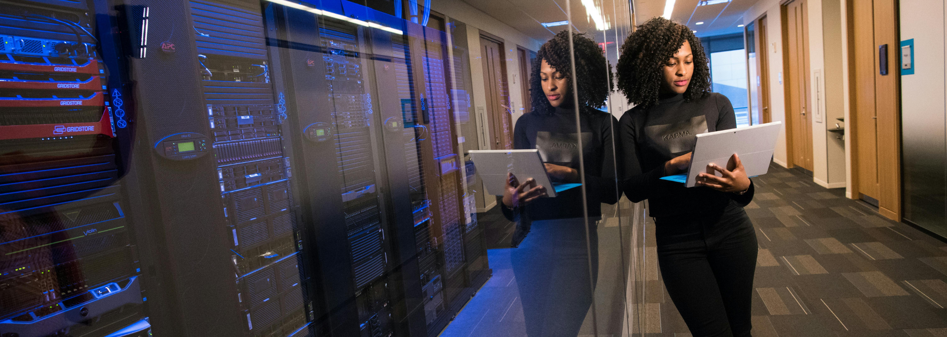 Picture of a professional in a server room.