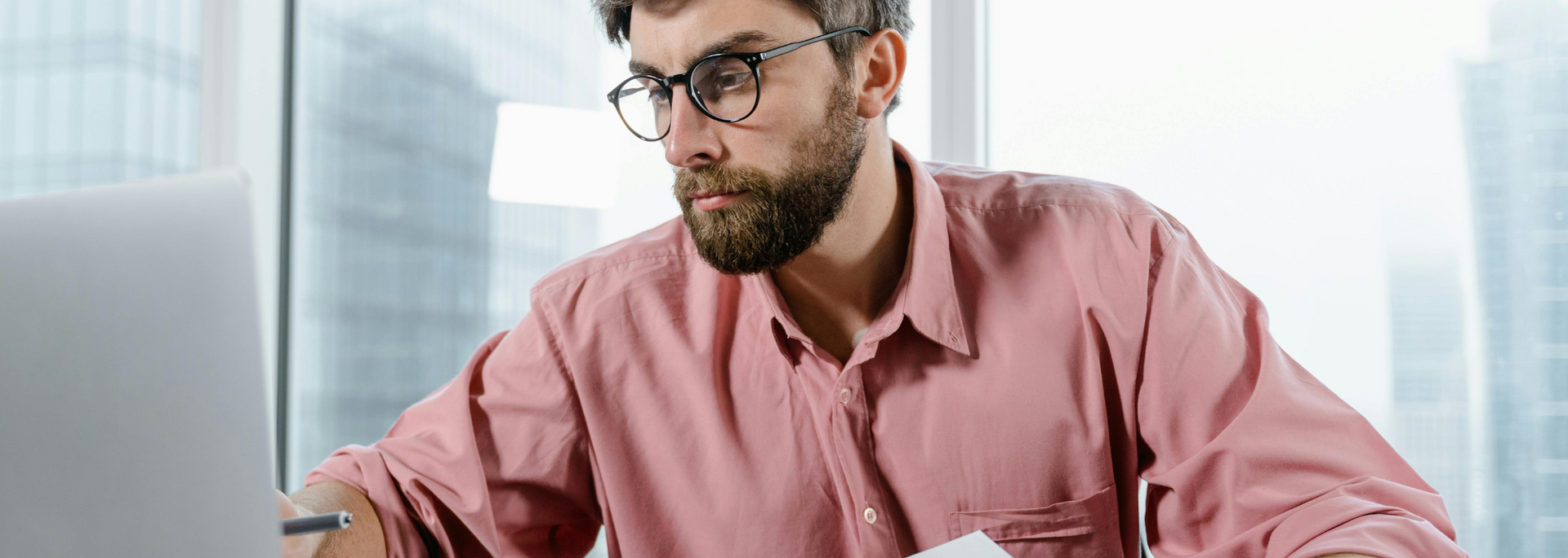 Picture of an office professional looking at a computer screen.