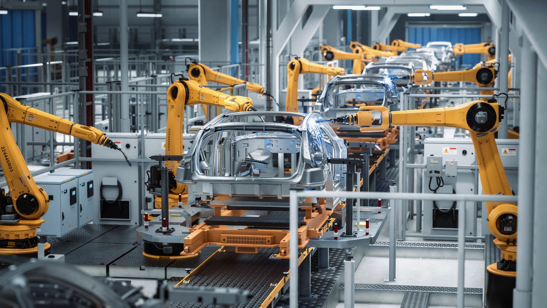 A factory filled with lots of robots making cars.