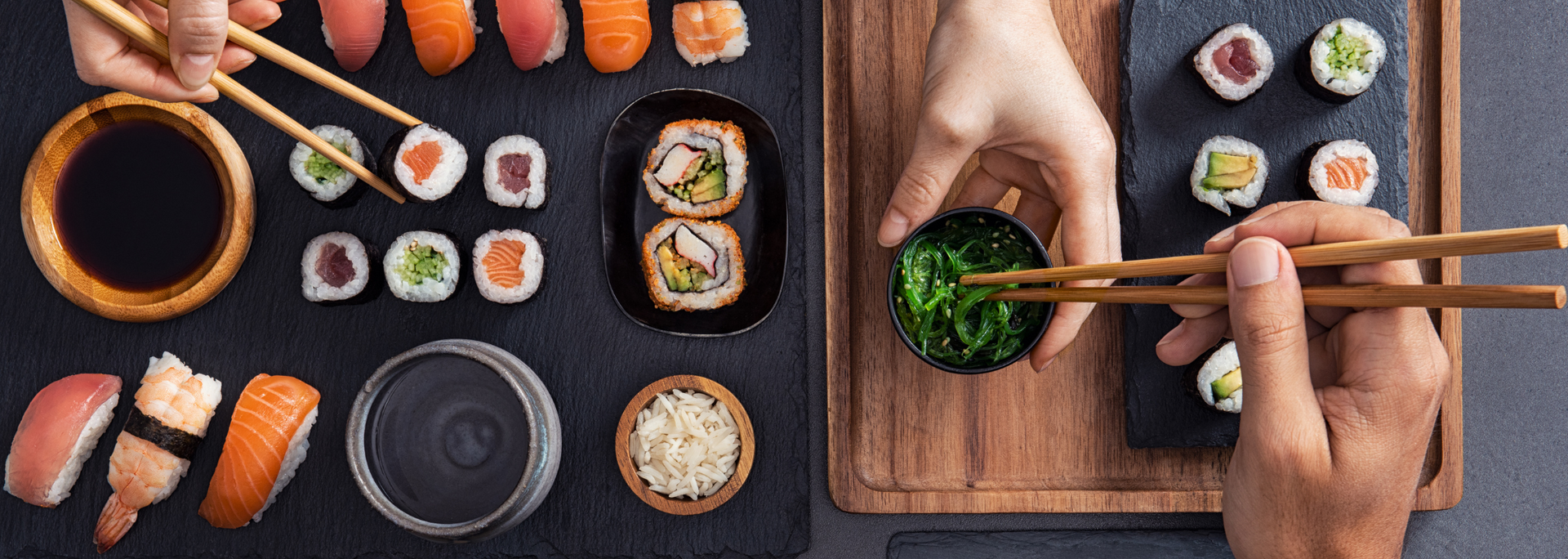 Picture of two people eating sushi.