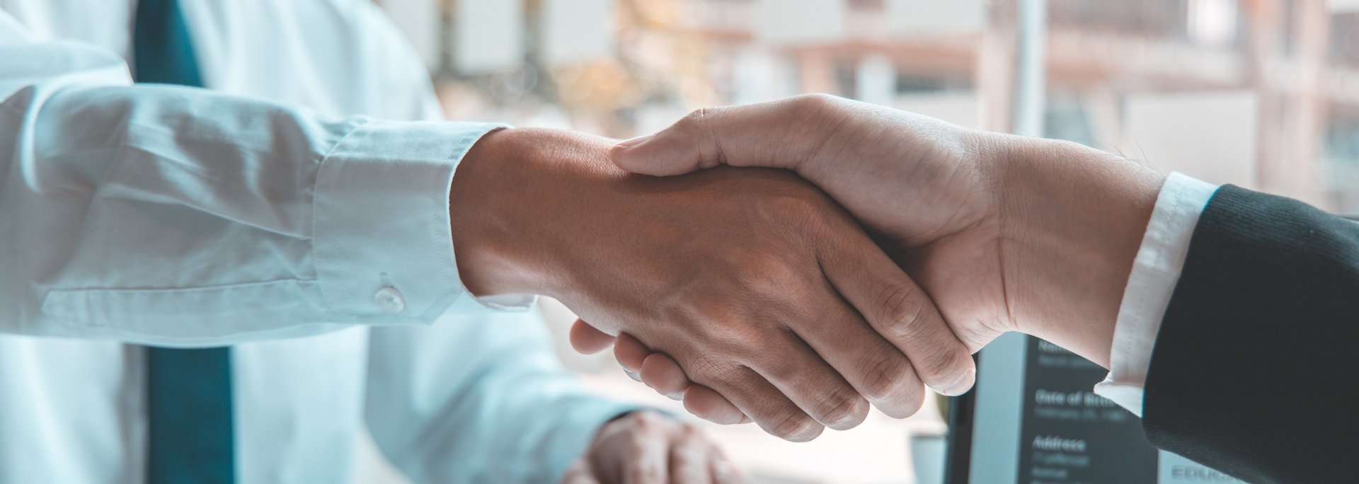 Picture of two people shaking hands after a job interview.