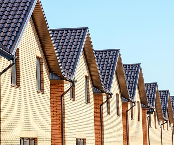row of cream colored homes