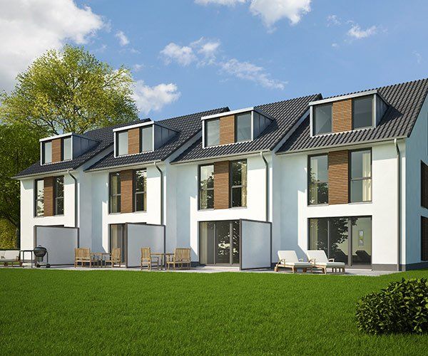 row of four white modern homes