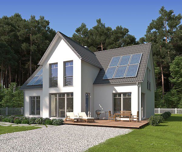 beautiful white home with solar panels on roof