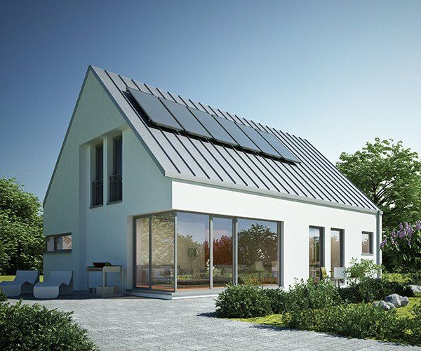white home with pitched roof and solar panels