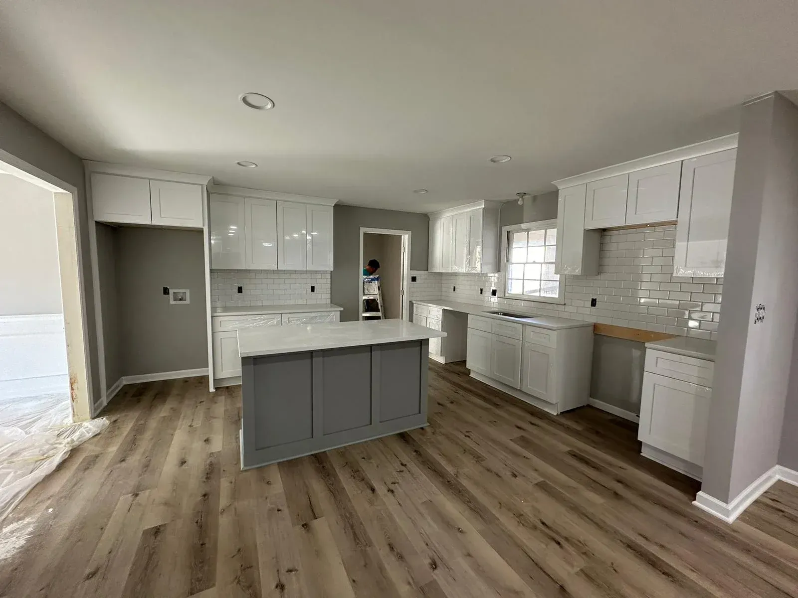 There are tables and chairs in the middle of a building.