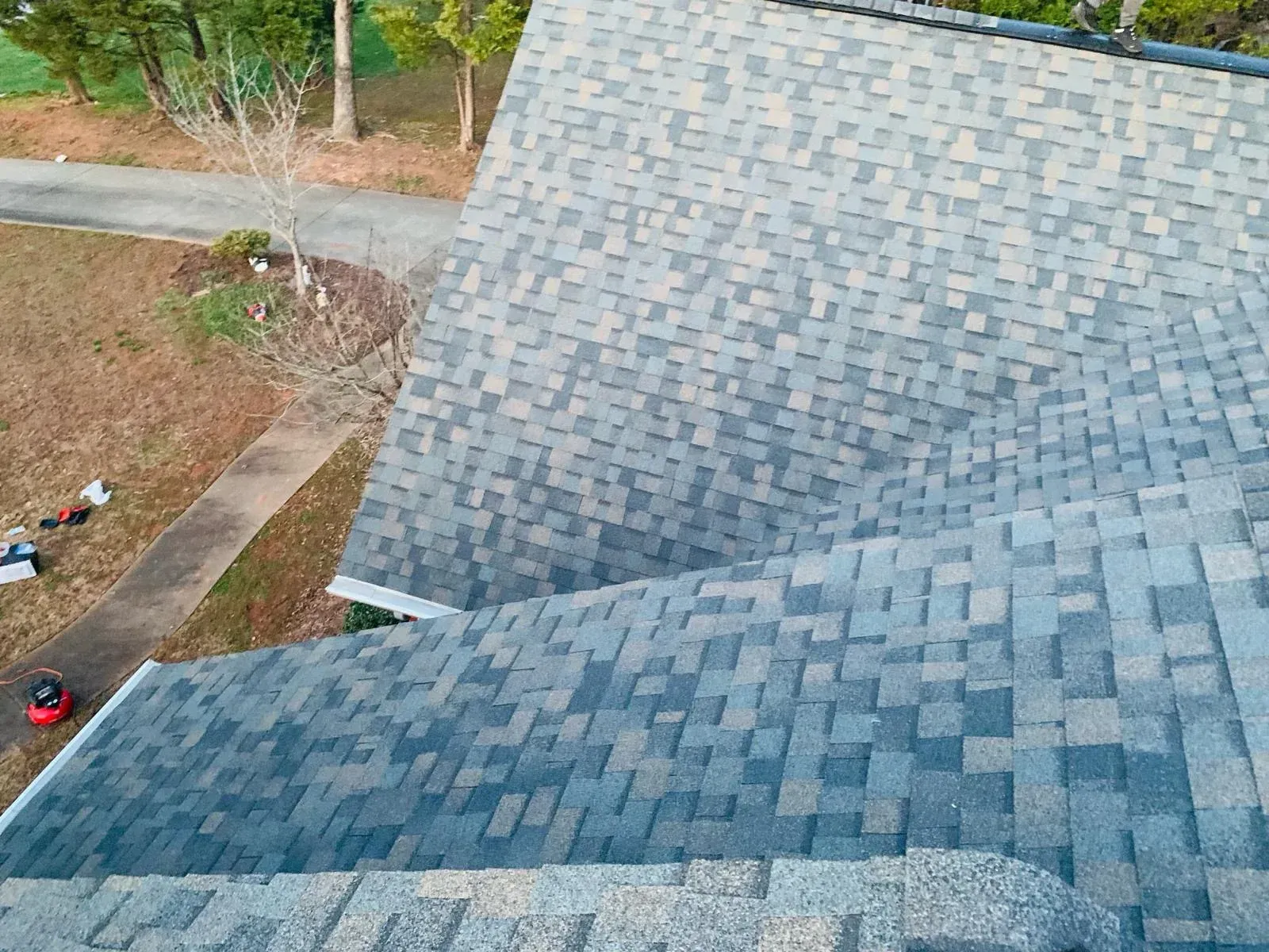 An aerial view of a roof with a lot of shingles on it.