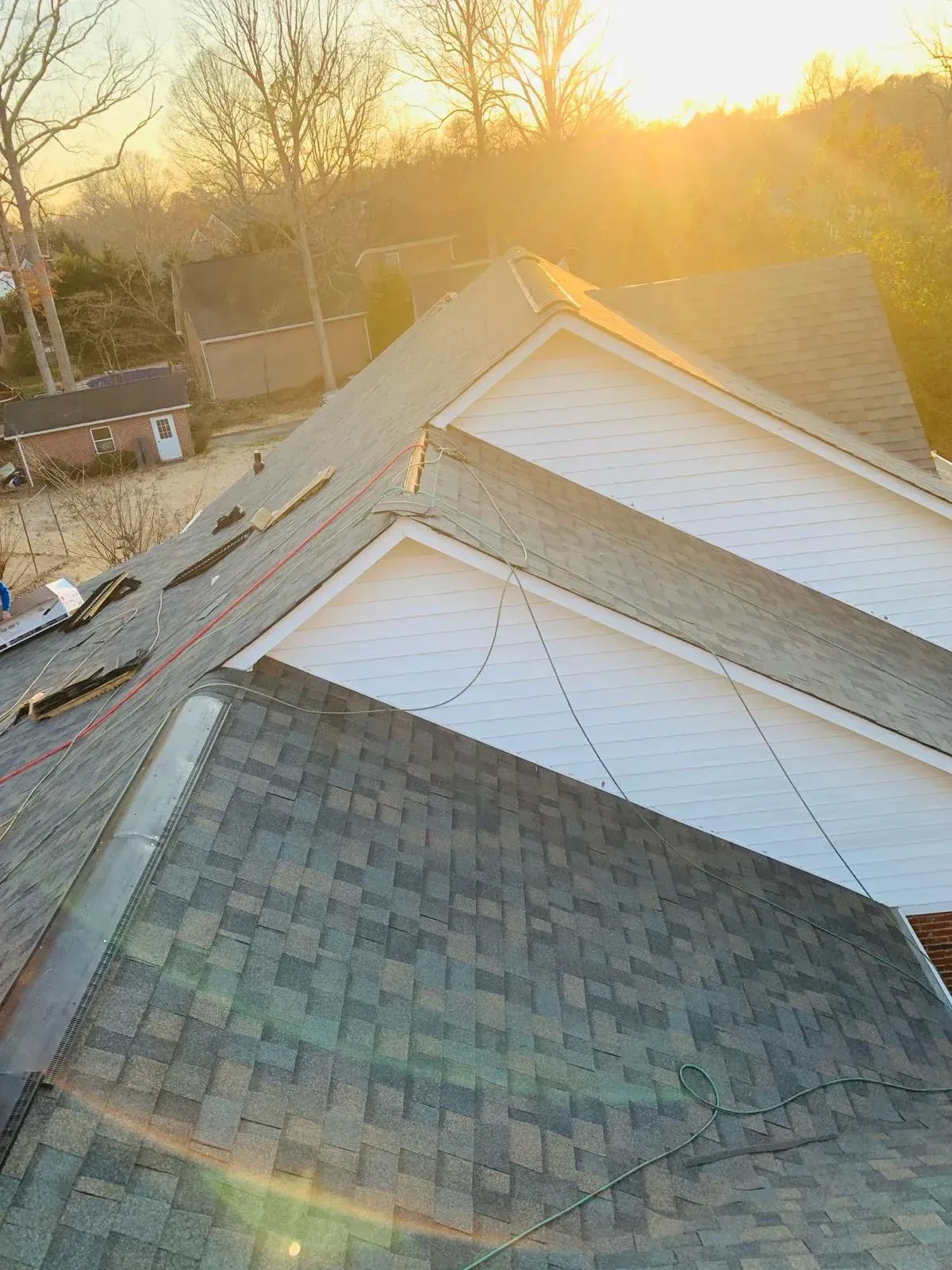 The sun is shining through the roof of a house.