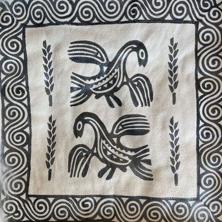 Two stylized black birds with wheat stalks and a spiral border on tan fabric.