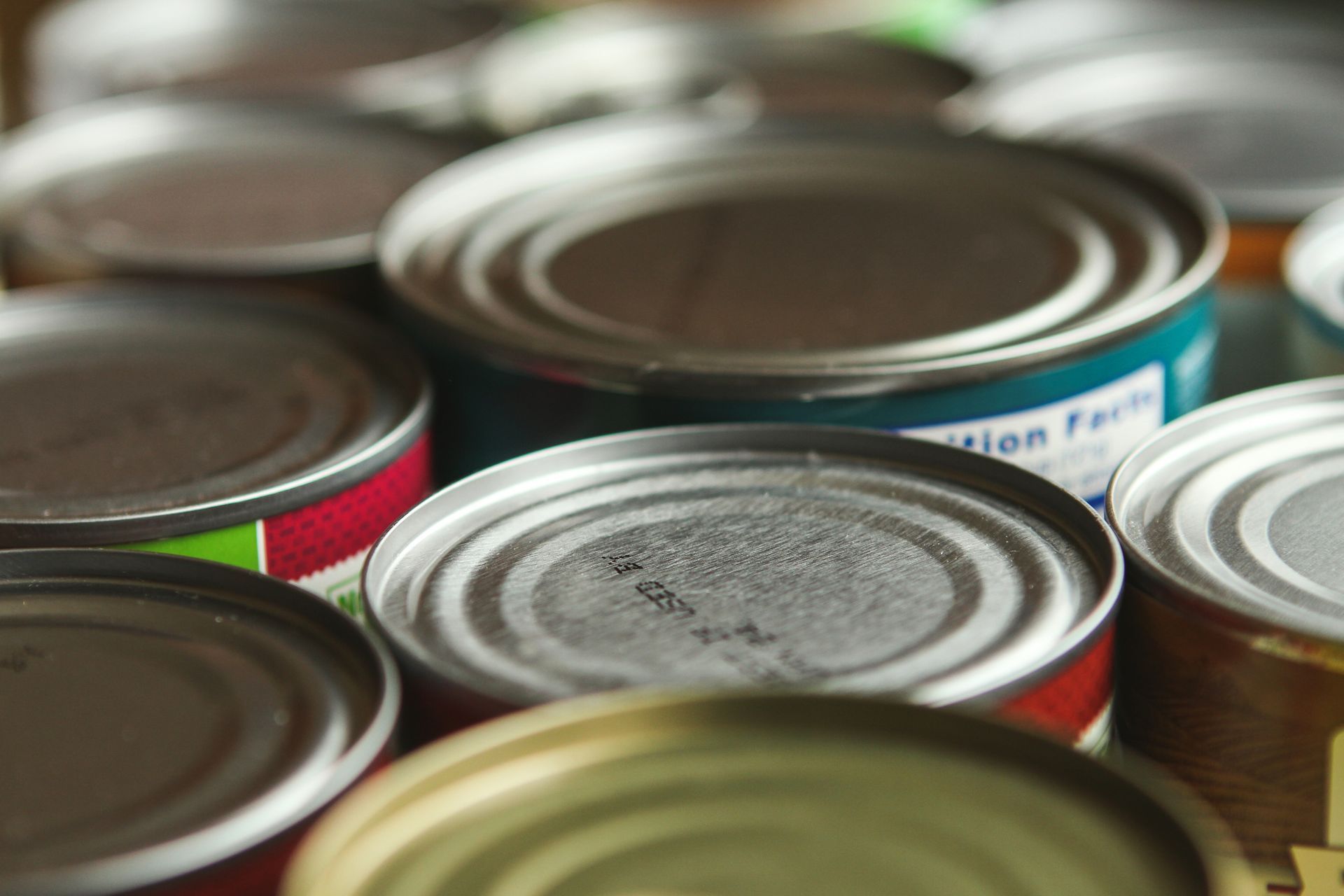 Several cans of food are stacked on top of each other